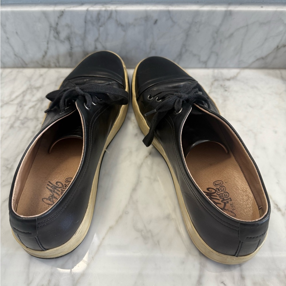 Black and Cream Sneakers with Decorative Tassels